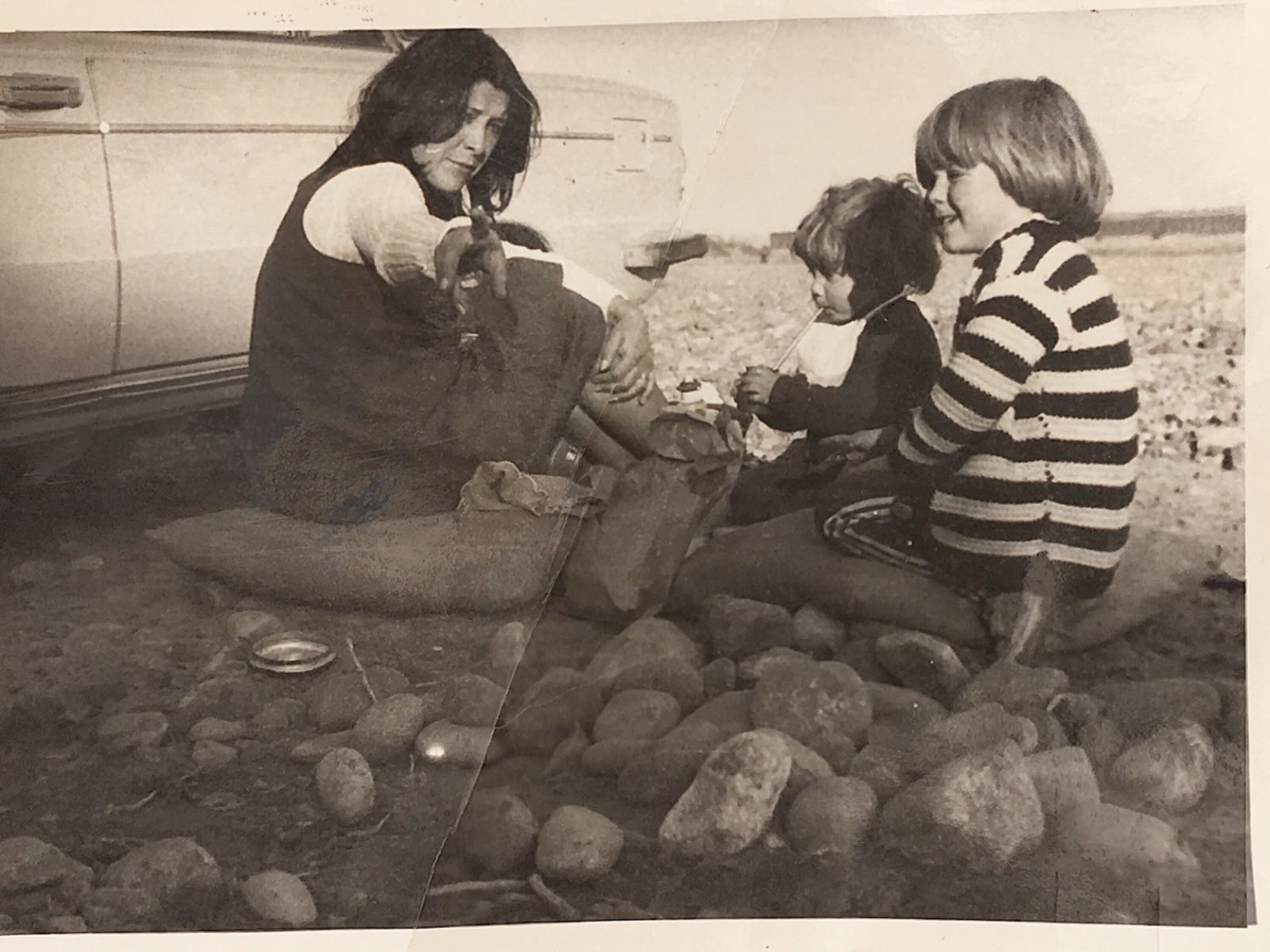 Pascua with Sebastian and his little brother on a rocky beach