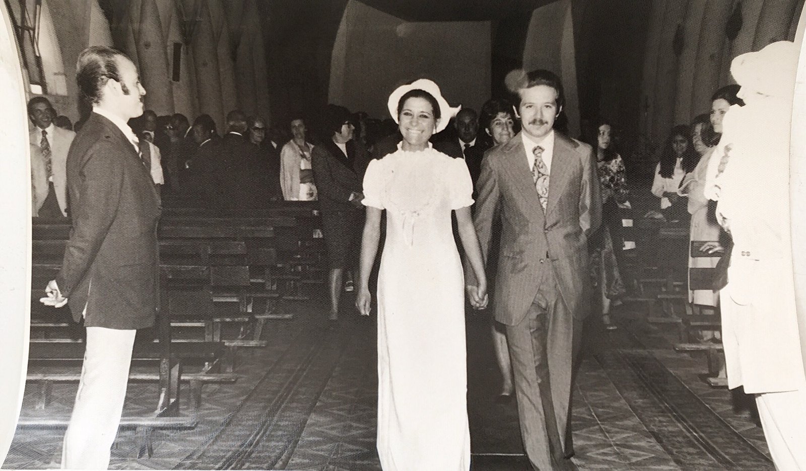 Armando and Pascua on their wedding day, walking down the aisle